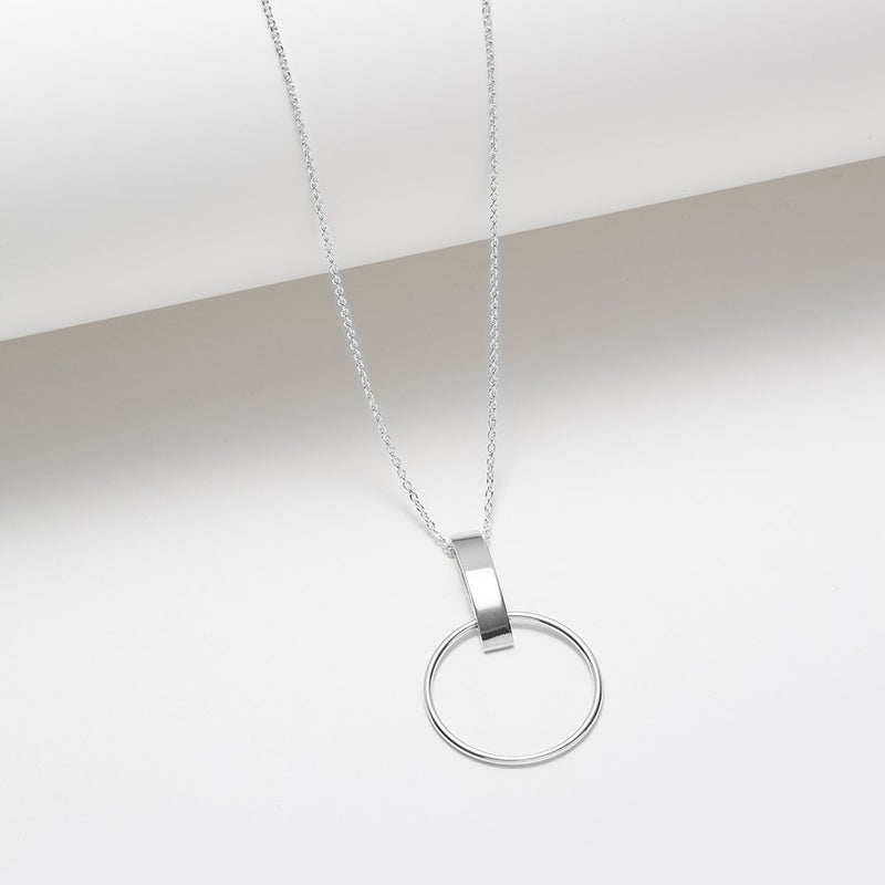 Long silver necklace with a circle and vertical bar pendant