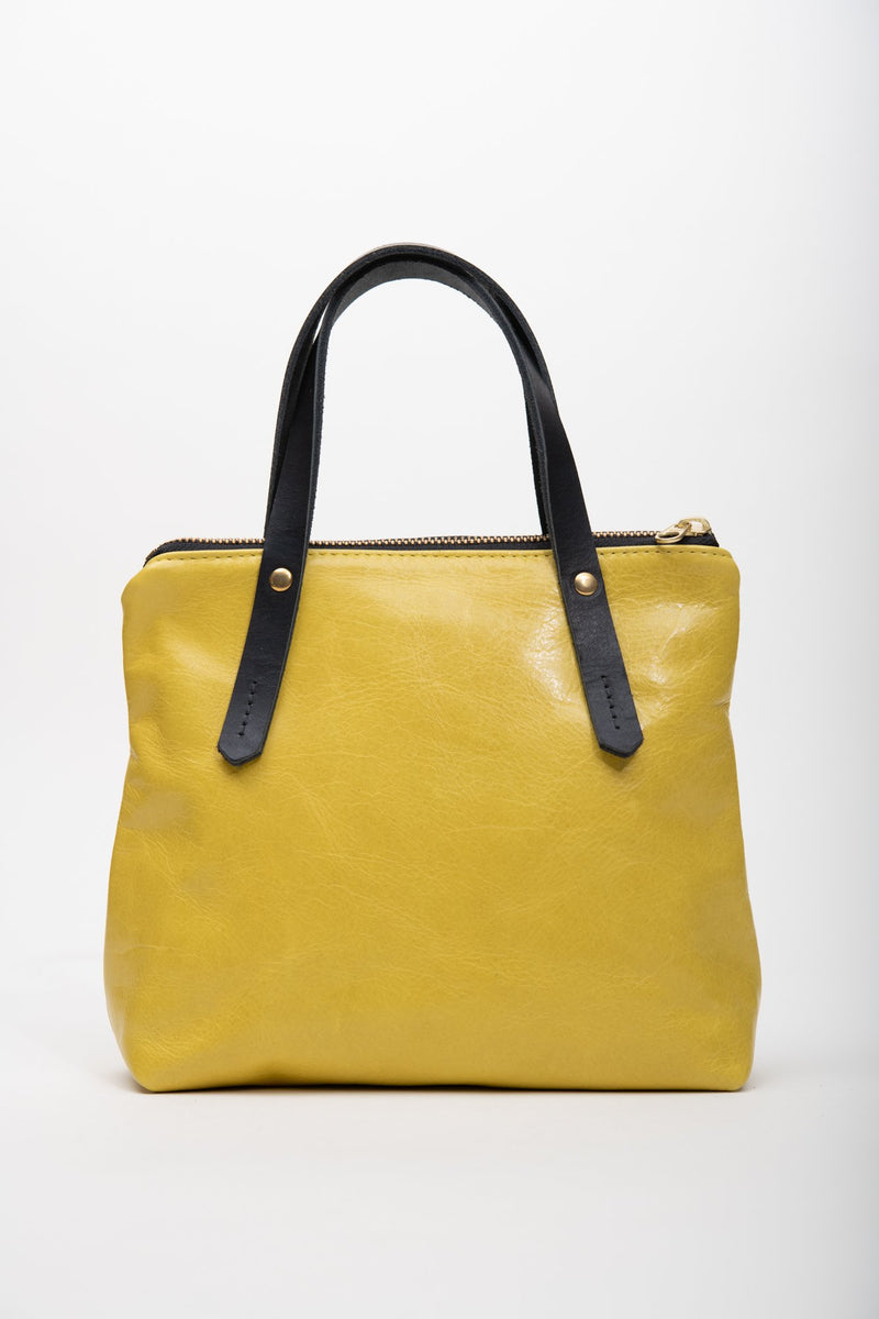 Yellow leather handbag with crossbody strap PAPINEAU model