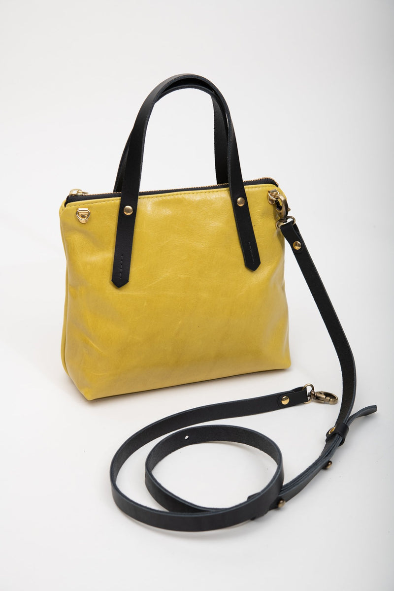 Yellow leather handbag with crossbody strap PAPINEAU model