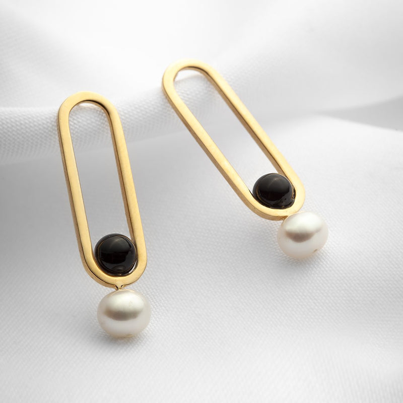 oblong gold stud earrings with black onyx stones and pearls