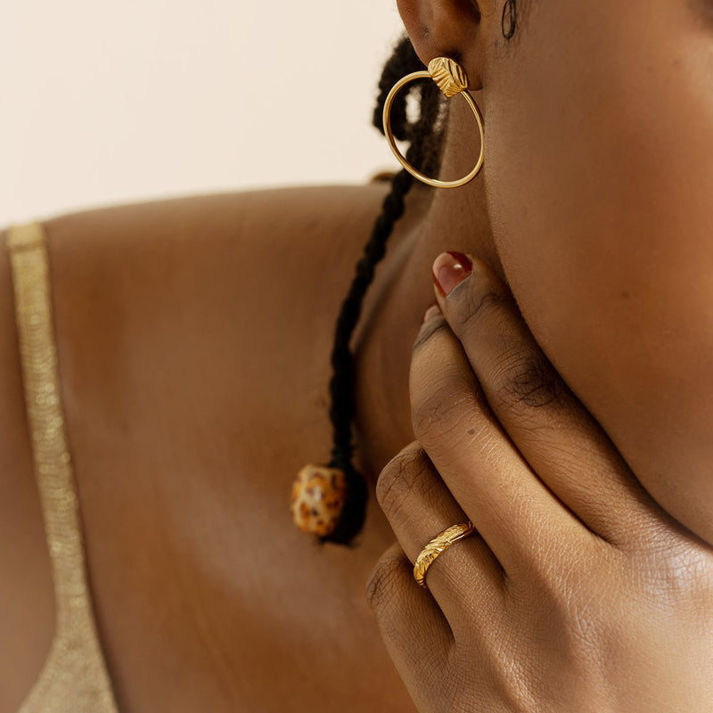 matching gold earrings and ring