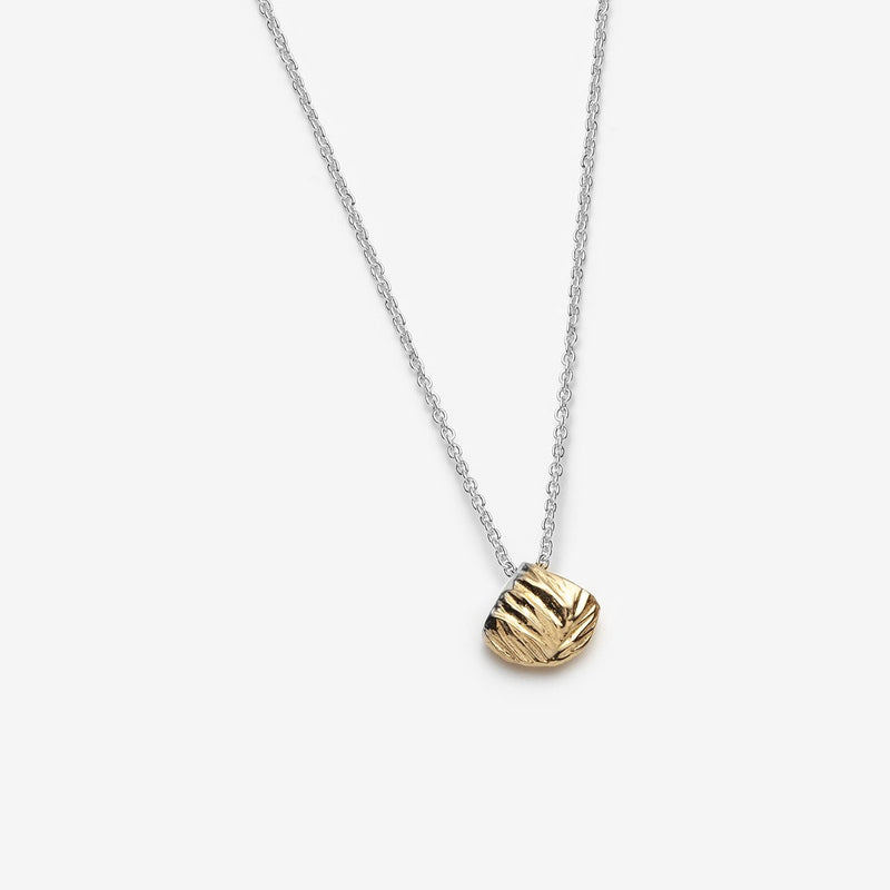 Simple gold pendant on a silver chain