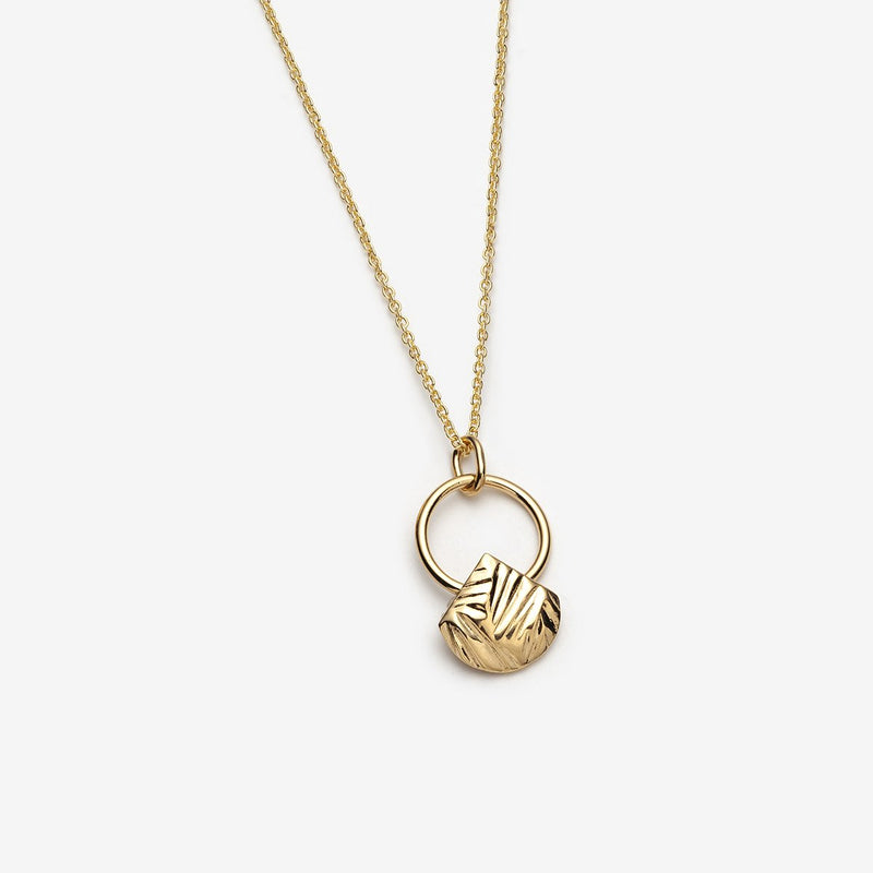 Open circle gold necklace with geometric dangling charm